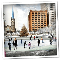 Ice skating at Cleveland's Public Square during Christmas nearby Mr. Kringle's Inventionasium Experience.
